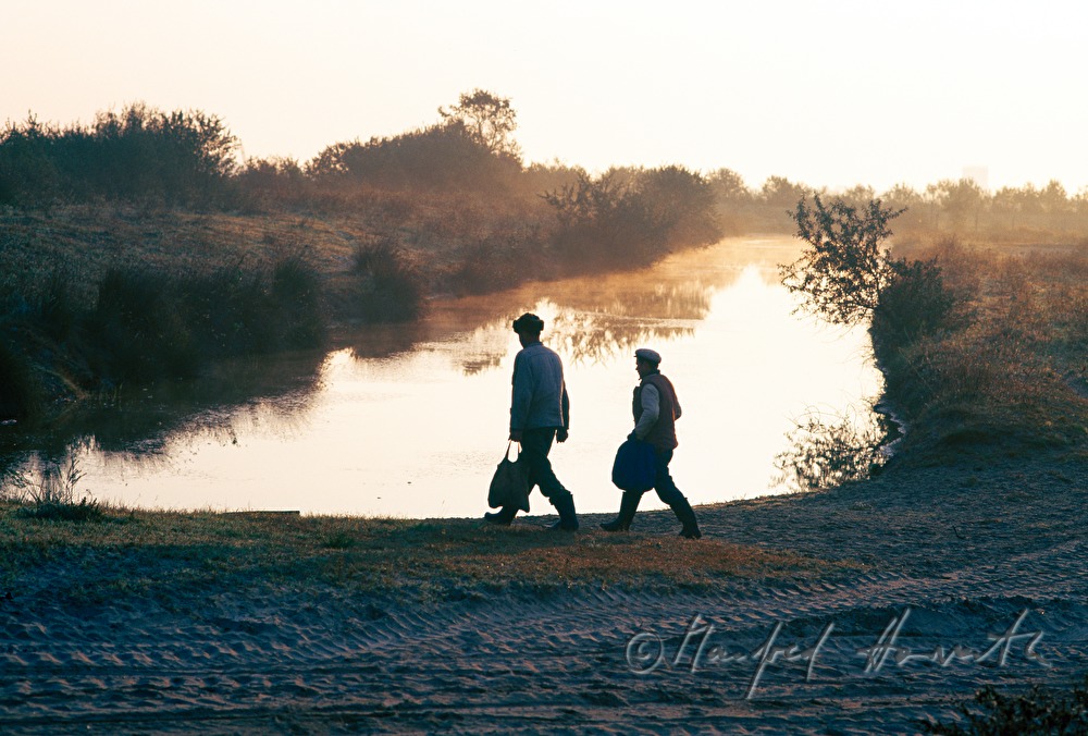two farmers on the way to the field